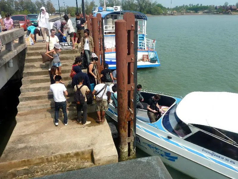 boarding the boat to Koh Mak at the krom luang pier in Laem Ngop